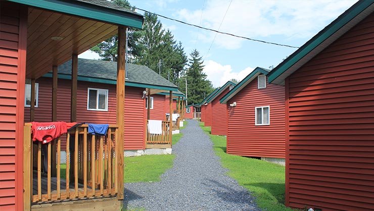 A path with red cabins on both sides