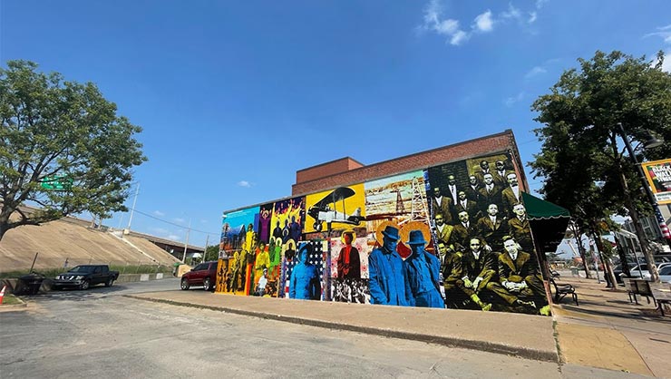 A mural on the side of a building, depicting the Tulsa Race Massacre, in Tulsa, Oklahoma