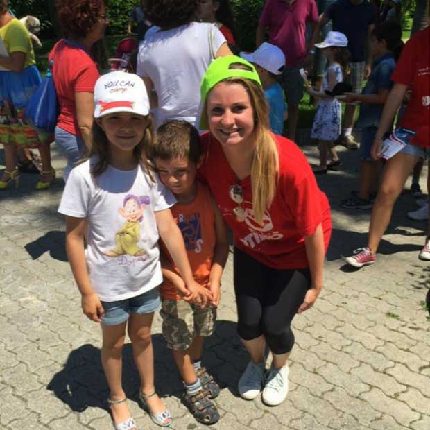Photo courtesy of Tara B. Posing with one of my campers and her brother.